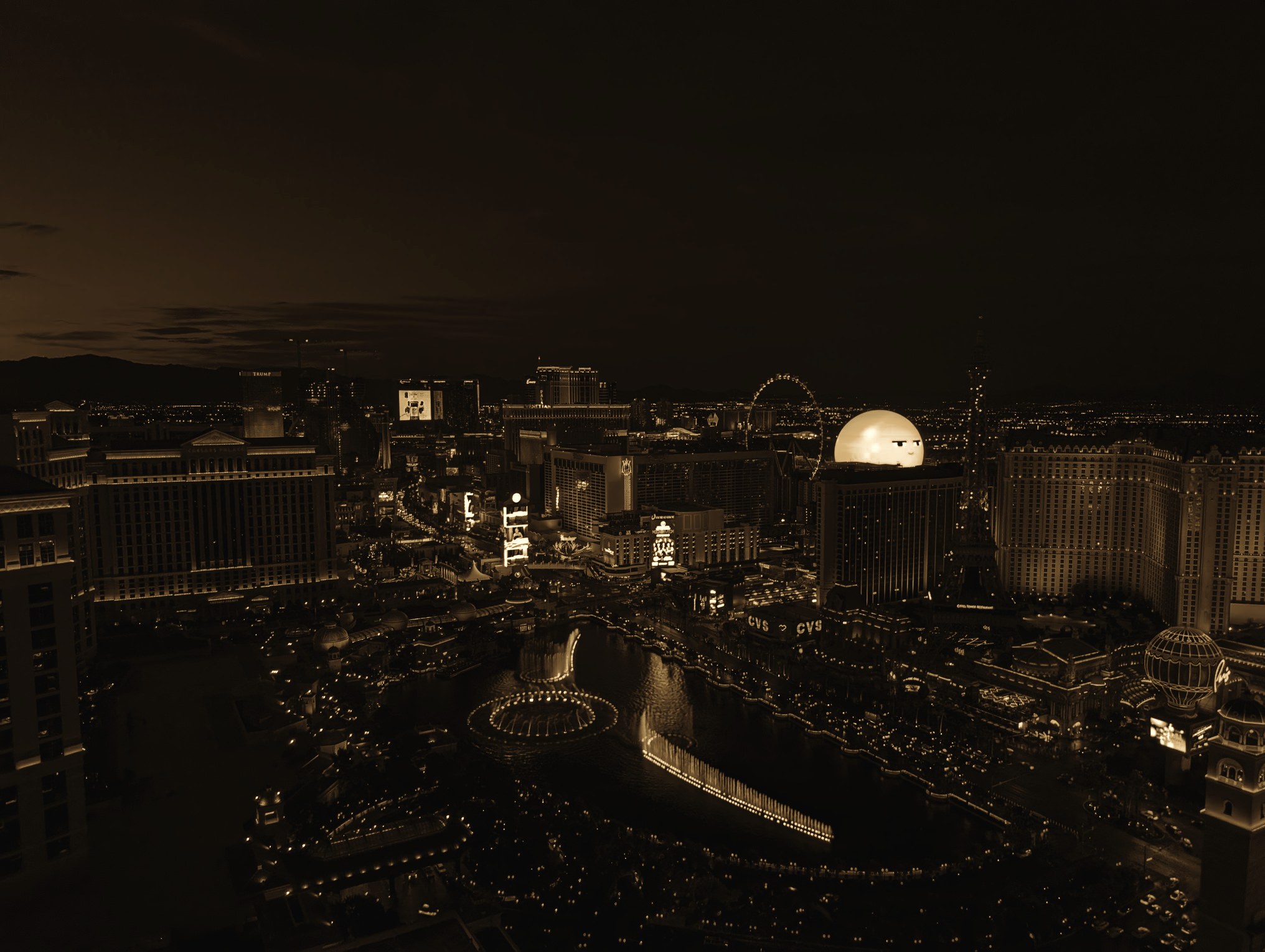 Aerial view of the Las Vegas Strip at twilight - Bellagio fountains, Sphere, Paris Las Vegas